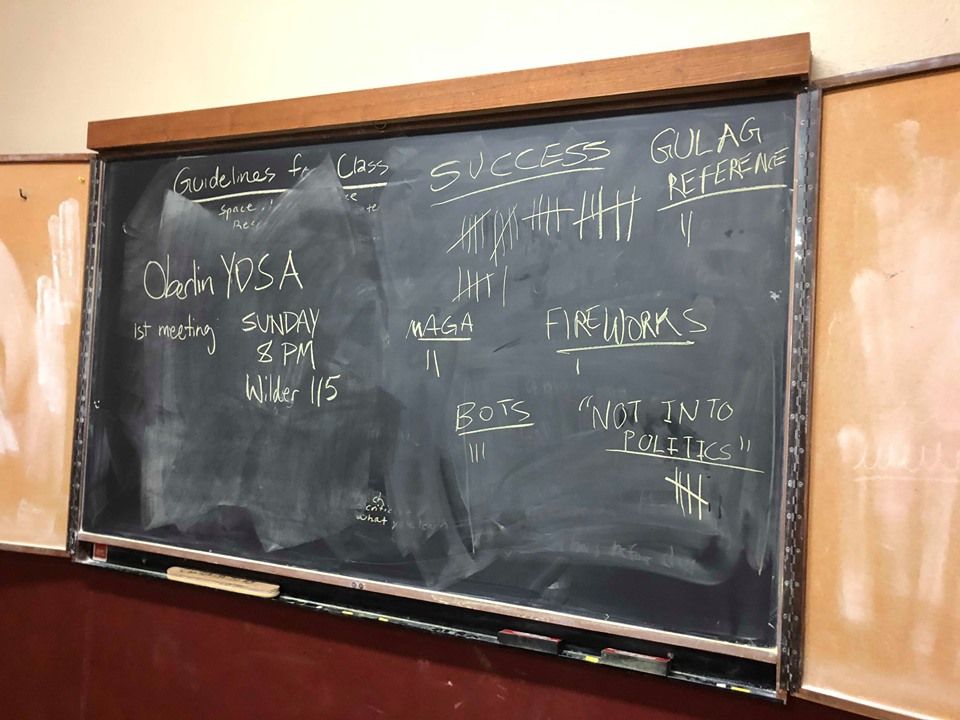 A blackboard showing the results of the phone-banking session: 26 successes, 2 Trump supporters, 3 bots, 2 gulag references, 1 response liste3d as "fireworks," and 5 responses indicating that they were "not into politics."